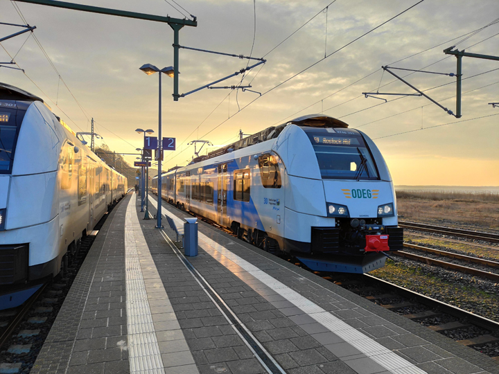 BeNEX train at platform at sunset