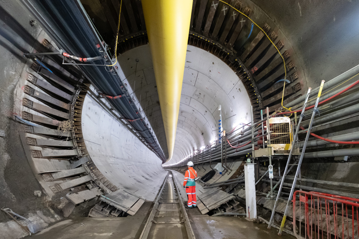 image of tunnel and construction worker
