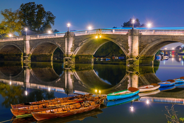 bridge and long boats on water